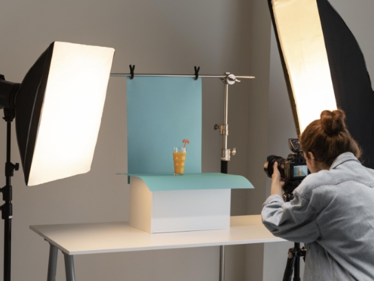 young female product photographer studio